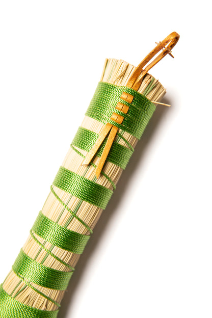 green hand broom handle wrapped in polytwine against a white background with gold leather hanger and gold plated star charm