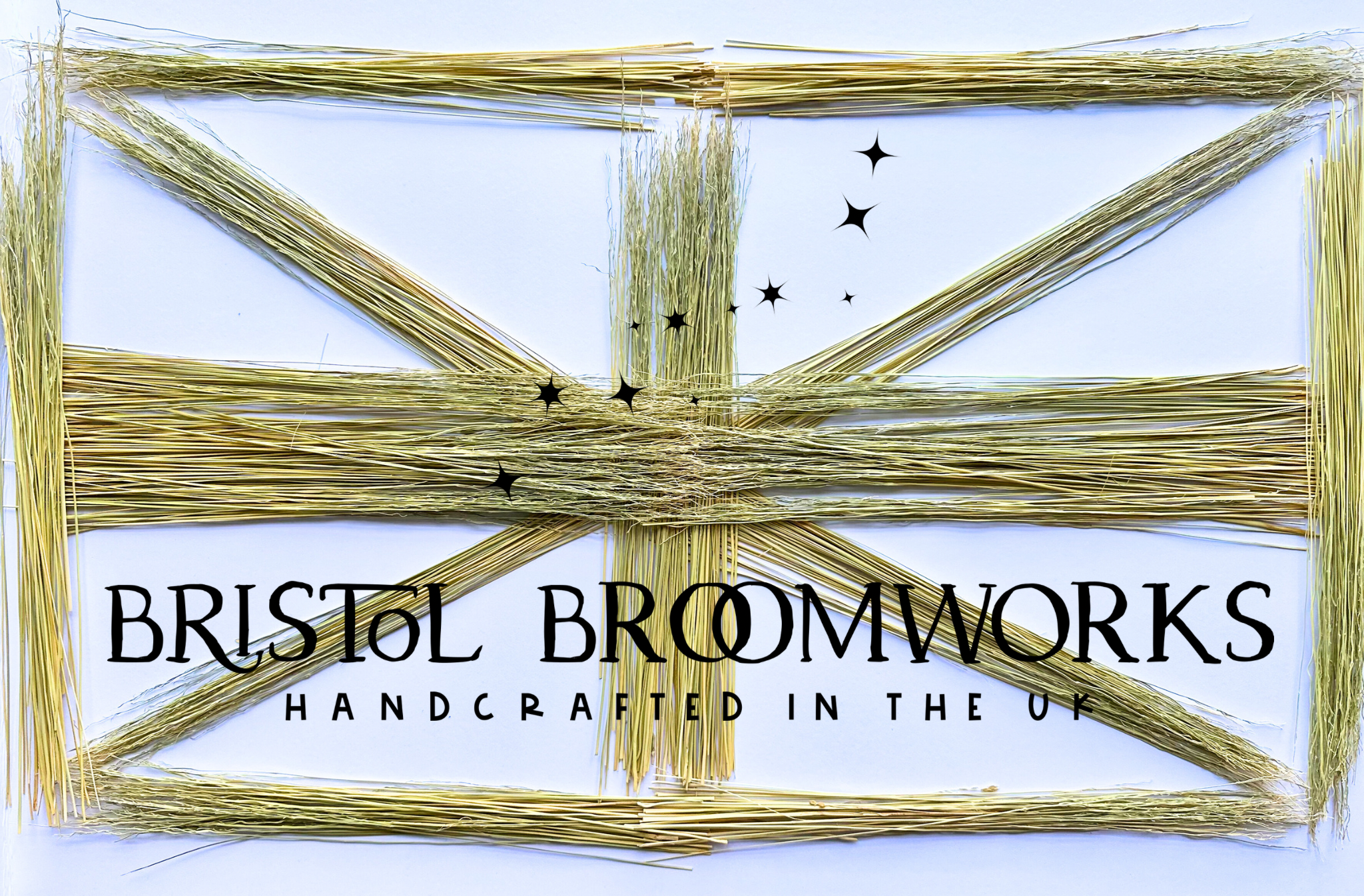A square product shot showing a handmade flag made from natural broomcorn, with the text 'BRISTOL BROOMWORKS' and 'HANDCRAFTED IN THE UK' printed across the centre on a white background